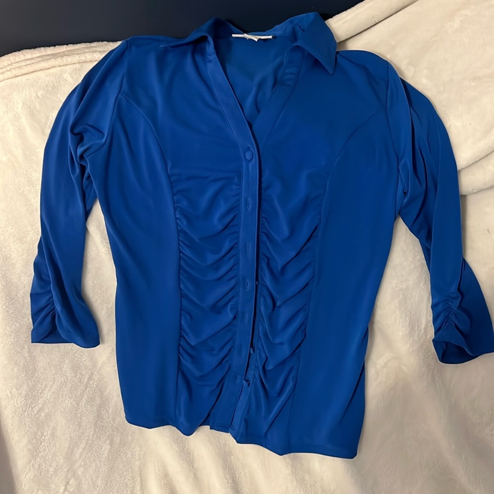 Selling this beautiful blue blouse, medium but fits a little snug